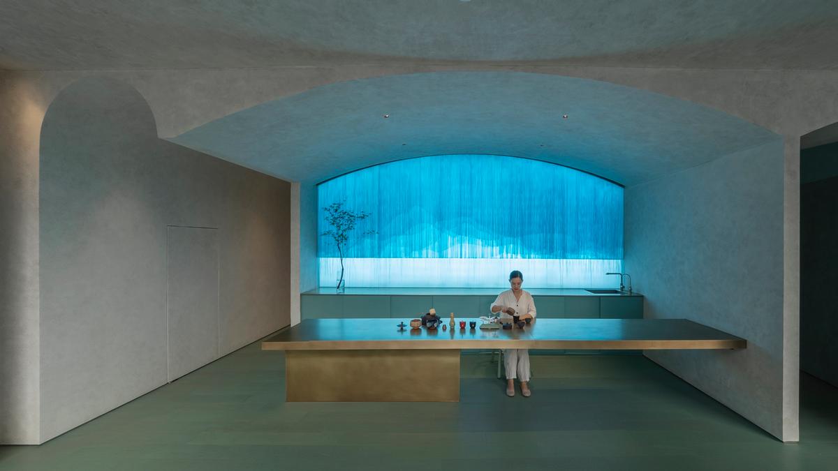 A deep blue lighting feature provides a backdrop for the clinic / Waterfrom Design