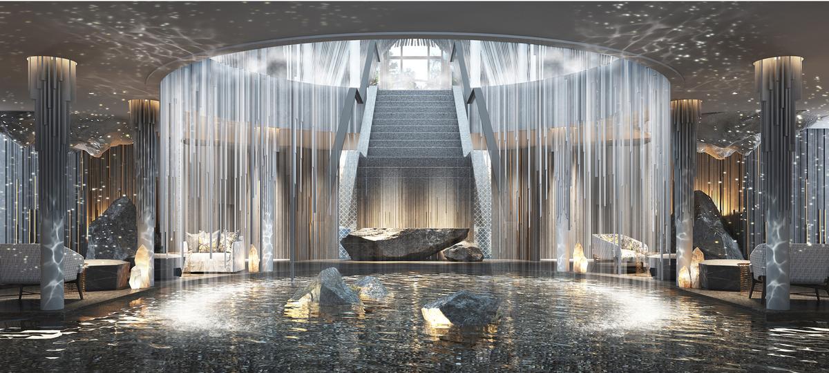 The centrepiece for the resort’s open-air lobby comprises a large circular cascading waterfall that falls into a running stream below / Banyan Tree
