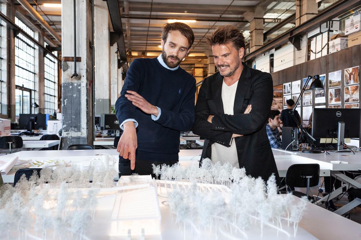 Jan Christian Vestre, CEO of Vestre (left) and Bjarke Ingels viewing a model of The Plus / Vestre/Bjarke Ingles Group