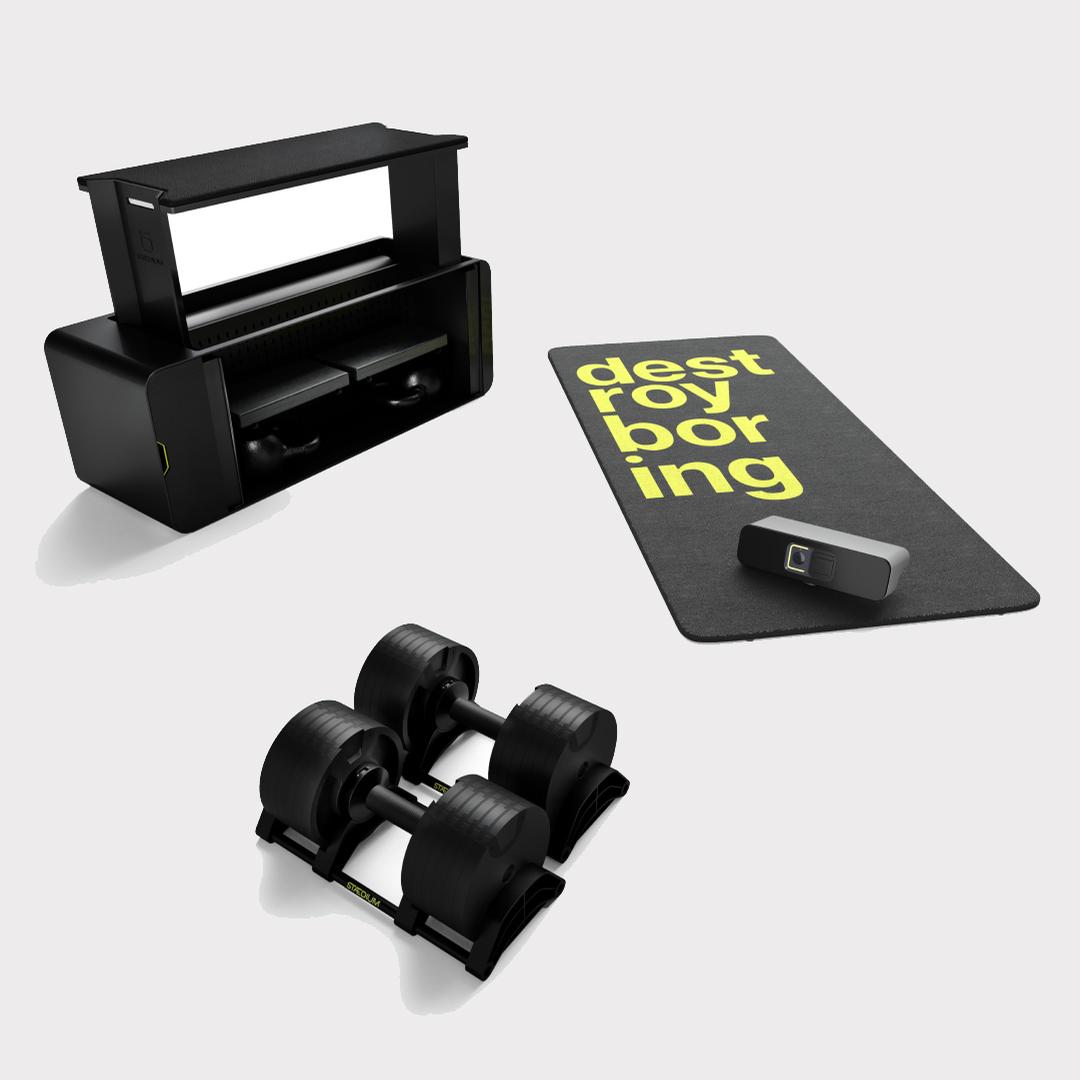 Designed for at-home use, the system uses three main components – the Stæd console, a base and a set of connected dumbbells / Freeletics