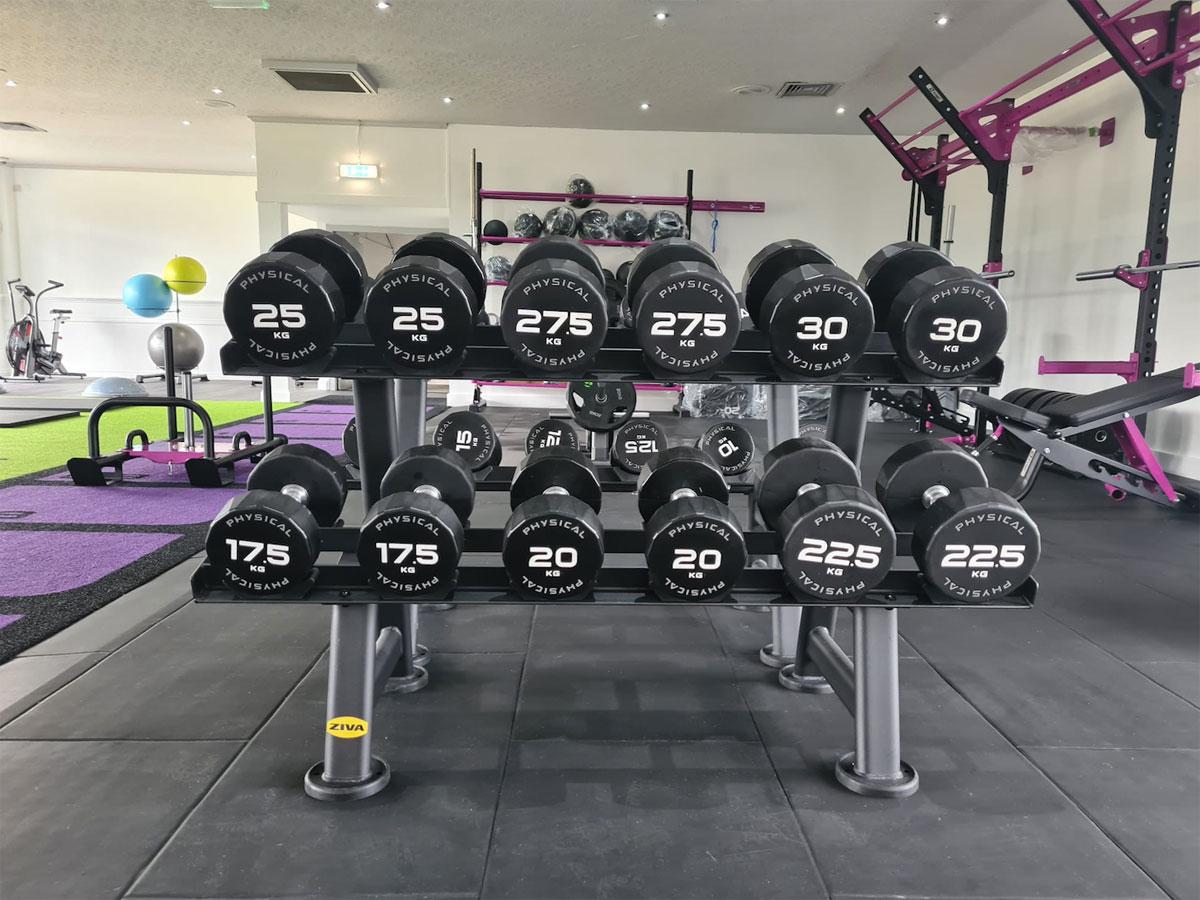 The gym includes free weights, CV equipment and a Pinnacle-branded turf area / Physical Company