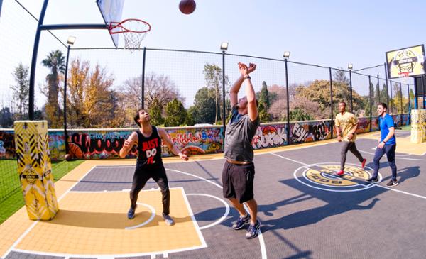 Outside spaces include a basketball court – there’s also a running track / Photo: Tim MoolmN / Body Action Gym