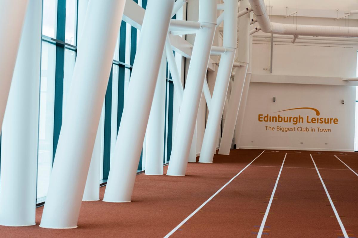 Six-lane indoor running track / Chris Watt Photography