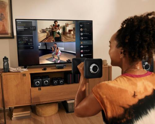 The Pelton Guide is a small AI-enabled box that sits underneath the TV / Peloton