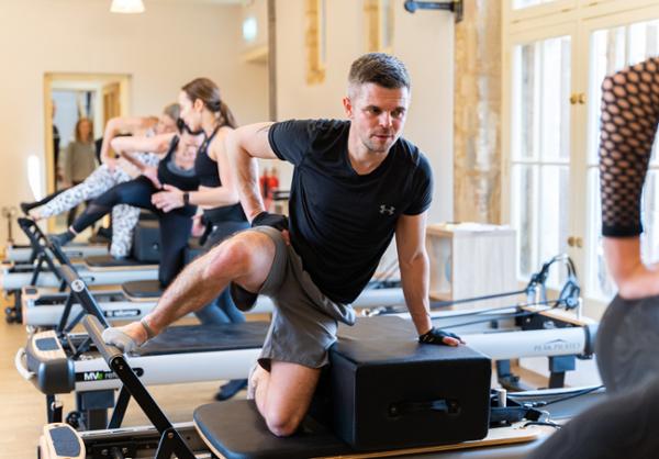 Growing your male Pilates membership may start with attracting them to train with their partners / photo: Tim Steele Photography / Gymkit uk / Peak Pilates