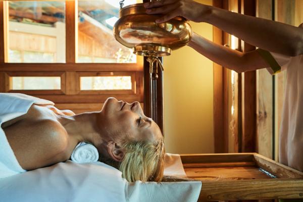 Bjurstam experiencing shirodhara in Bhutan. She feels ayurveda is the most crucial healing method / photo: Frederic Lagrange
