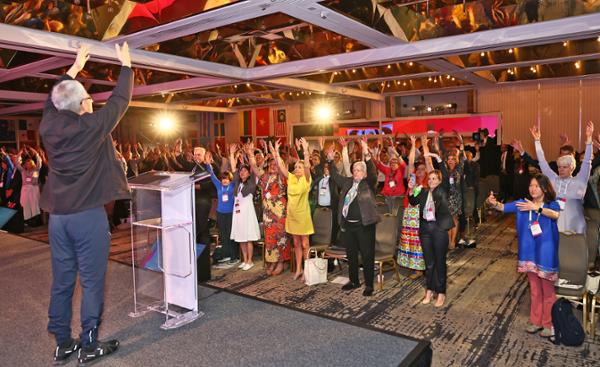 Delegates take a moment to stretch and refocus / photo: Global Wellness Summit 2023