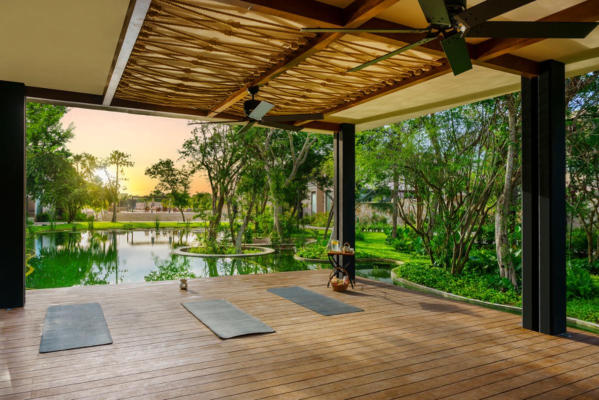 The spa is home to an outdoor yoga and meditation deck with soothing 
waterside views / Banyan Tree Group