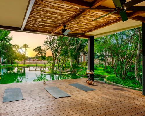 The spa is home to an outdoor yoga and meditation deck with soothing 
waterside views / Banyan Tree Group