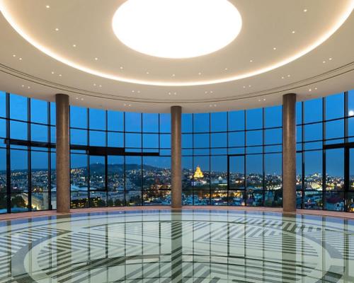 The spa's pool area provides expansive panoramic views of the Georgian capital city