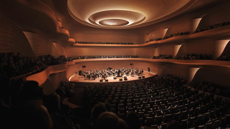 The main Concert Hall features intimate seating areas that weave and interlock seamlessly to provide optimal views of the stage / bucharest.studio