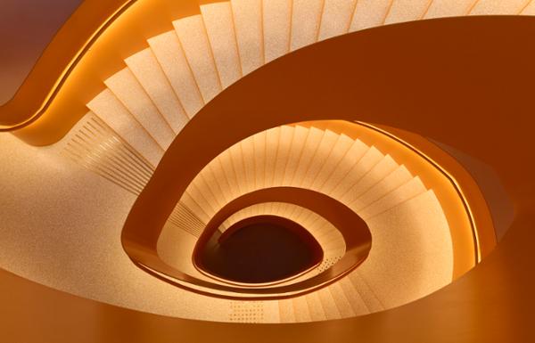 The colour of the neon-lit staircase was inspired by nearby warehouses