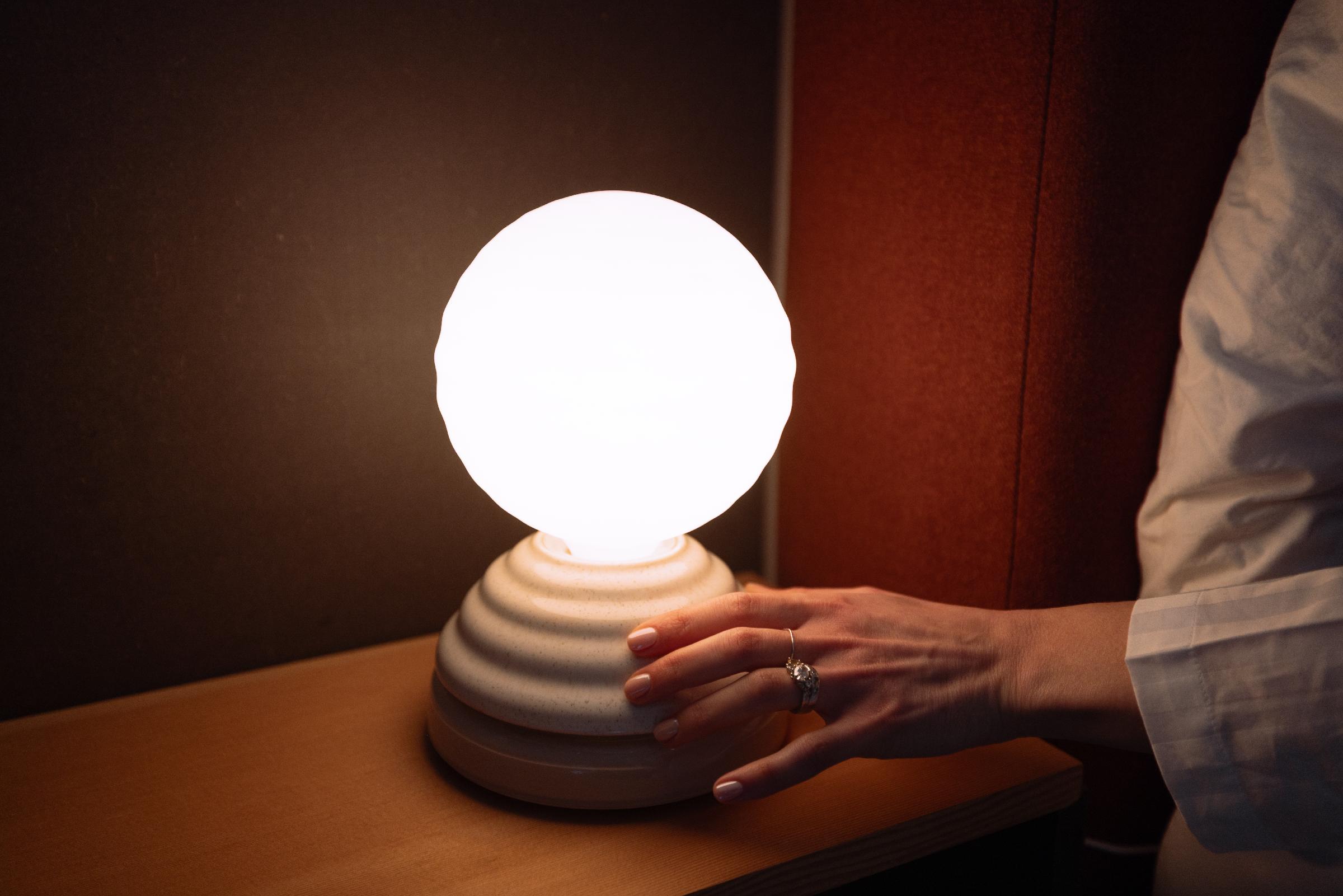 Wake is crafted from hand-spun ceramic and pressed glass, behind which a gentle light emanates to improve sleep routines and wellbeing / Tala/ Heatherwick Studio