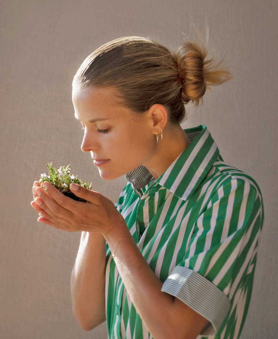 Irene Forte holding herbs up to her nose