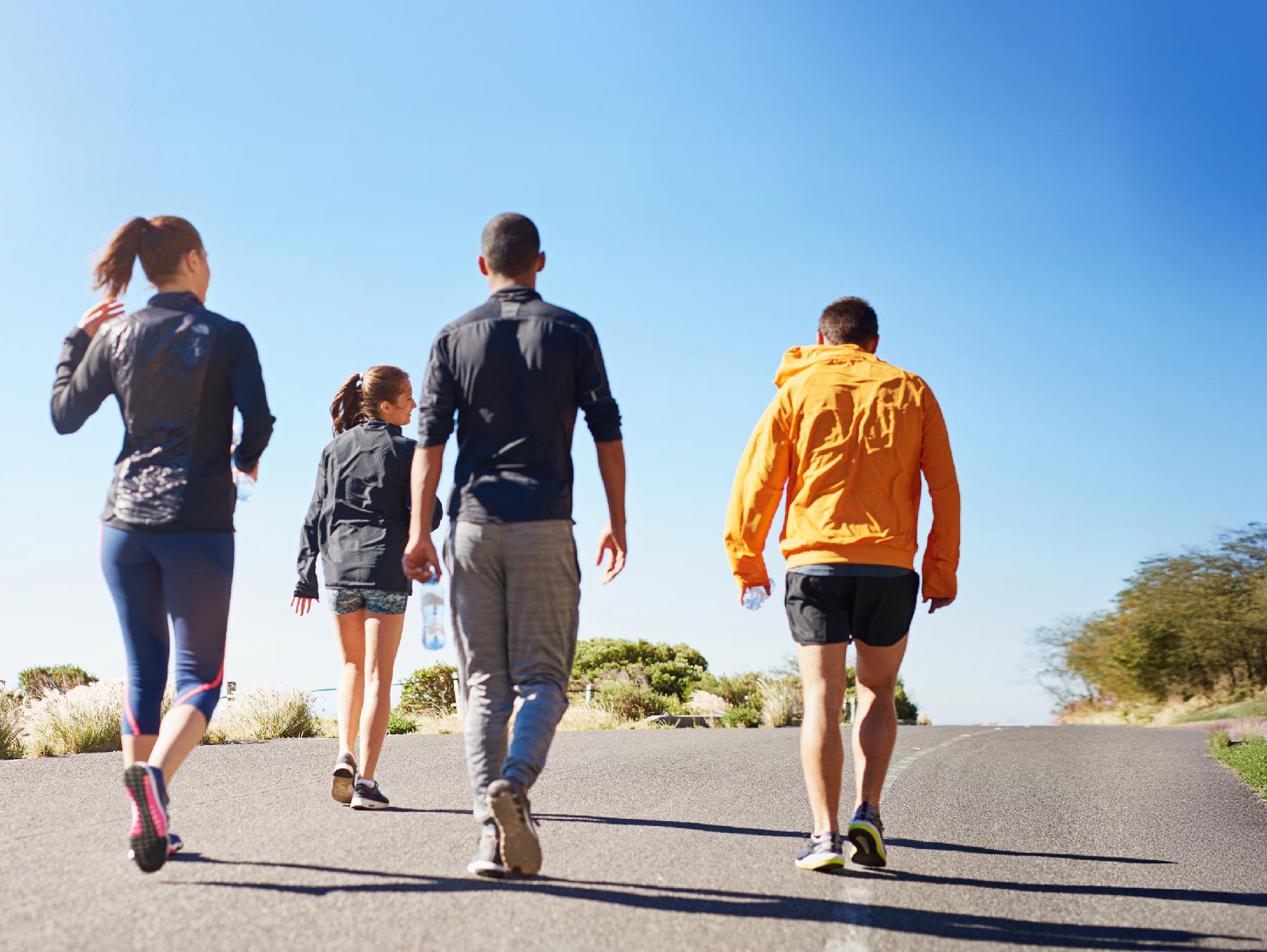 People walking outdoors in gym clothes