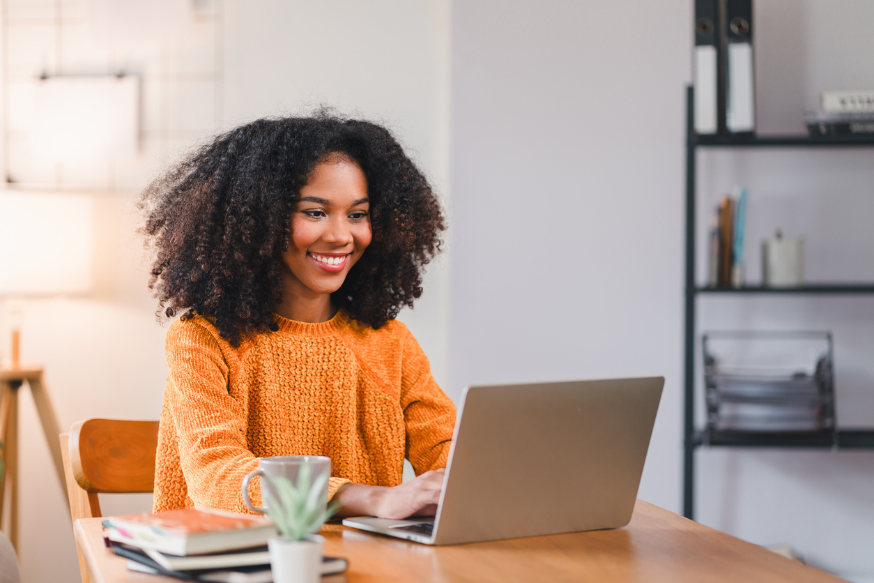 Woman sitting at a desk using laptop