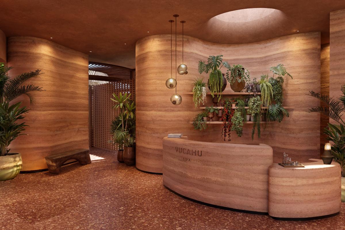 The design features rammed-earth walls in warm terracotta tones to echo the colours of Caribbean soil / Kala Design Group