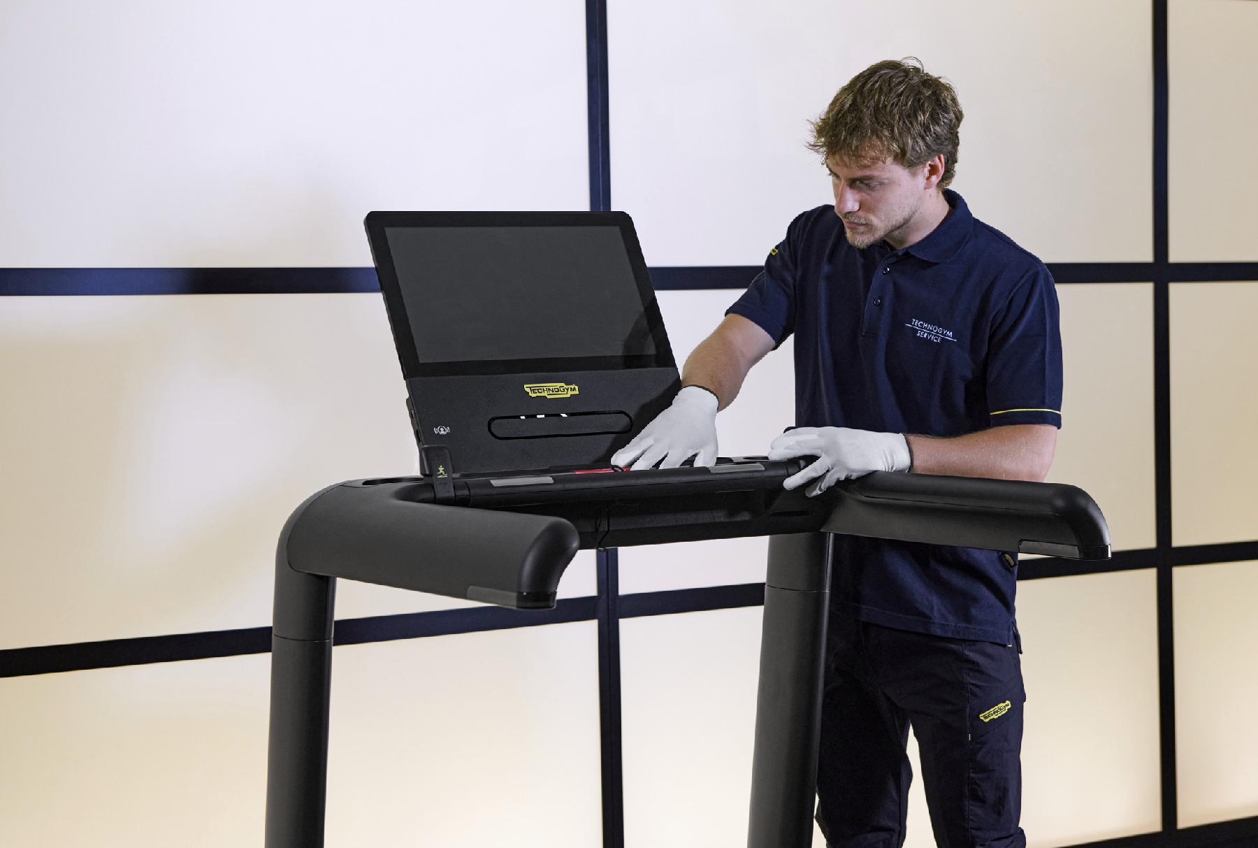 Technician checking Technogym equipment
