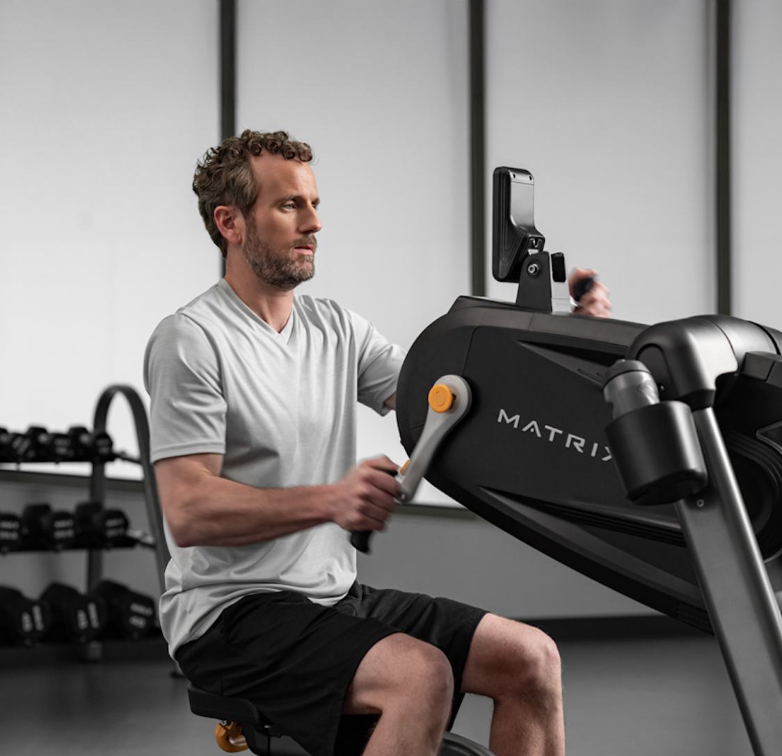 Man using Matrix gym equipment