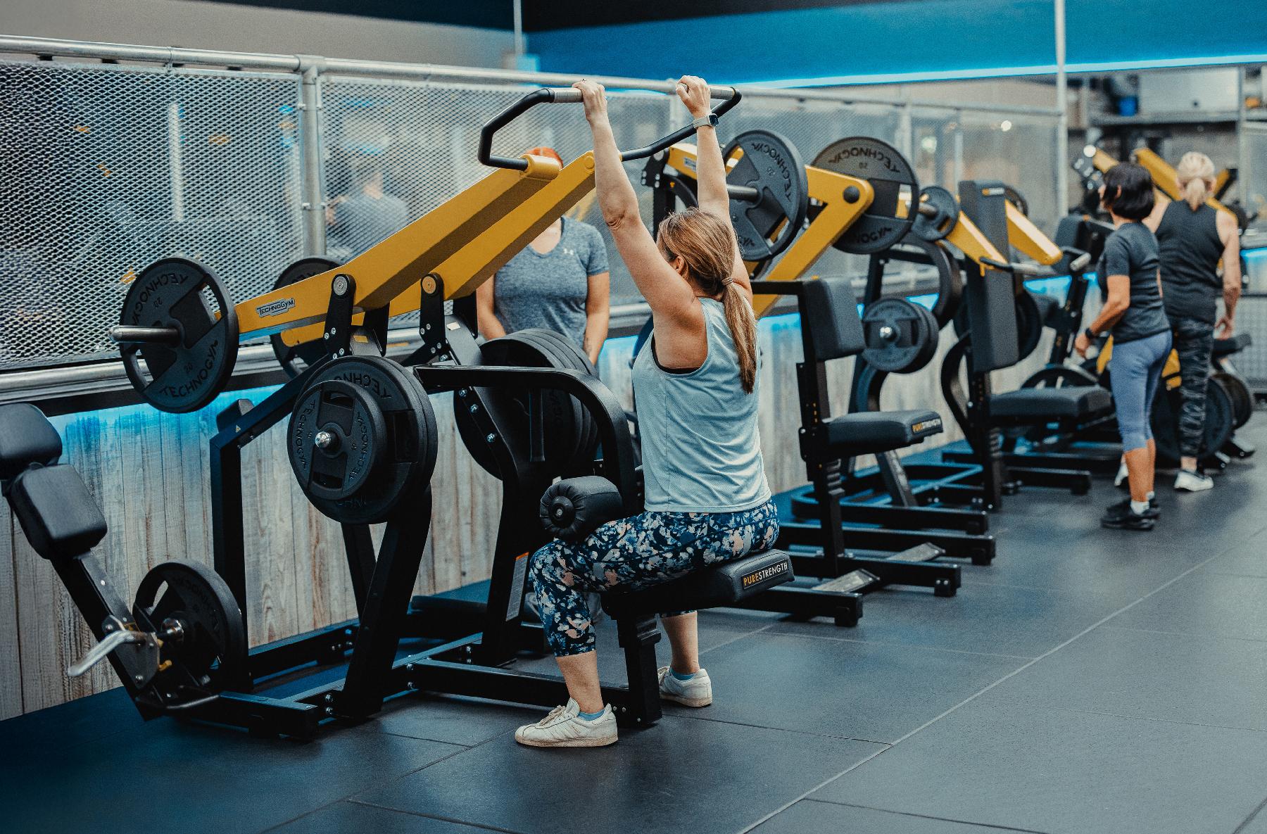 Women using gym equipment