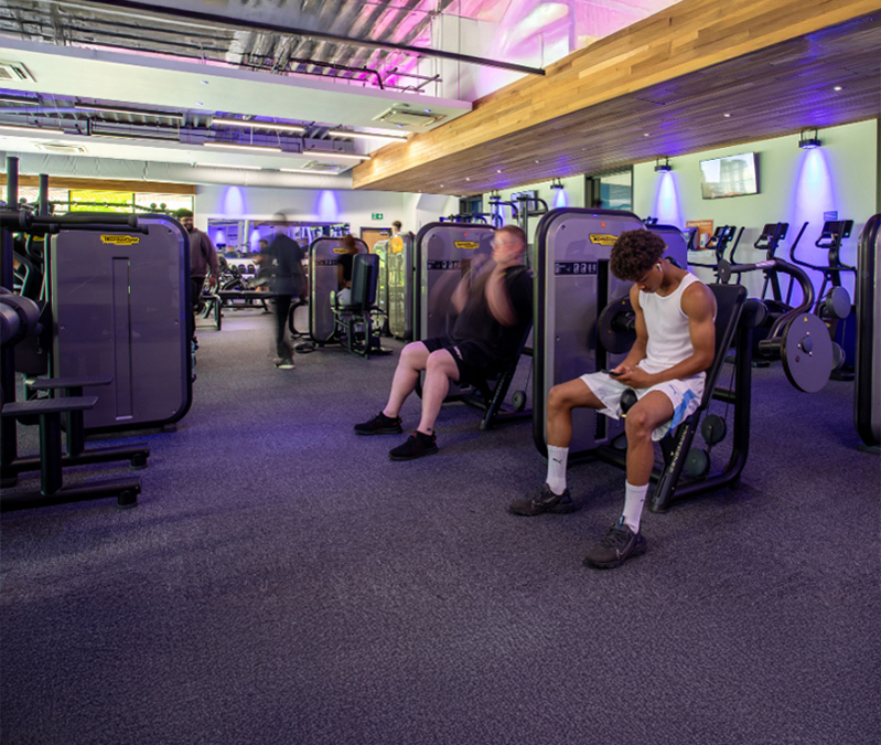 Men using gym equipment