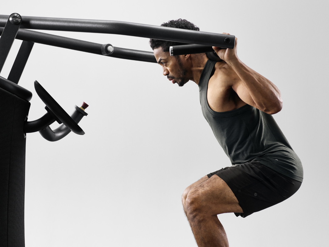 Man using EGYM connected strength equipment
