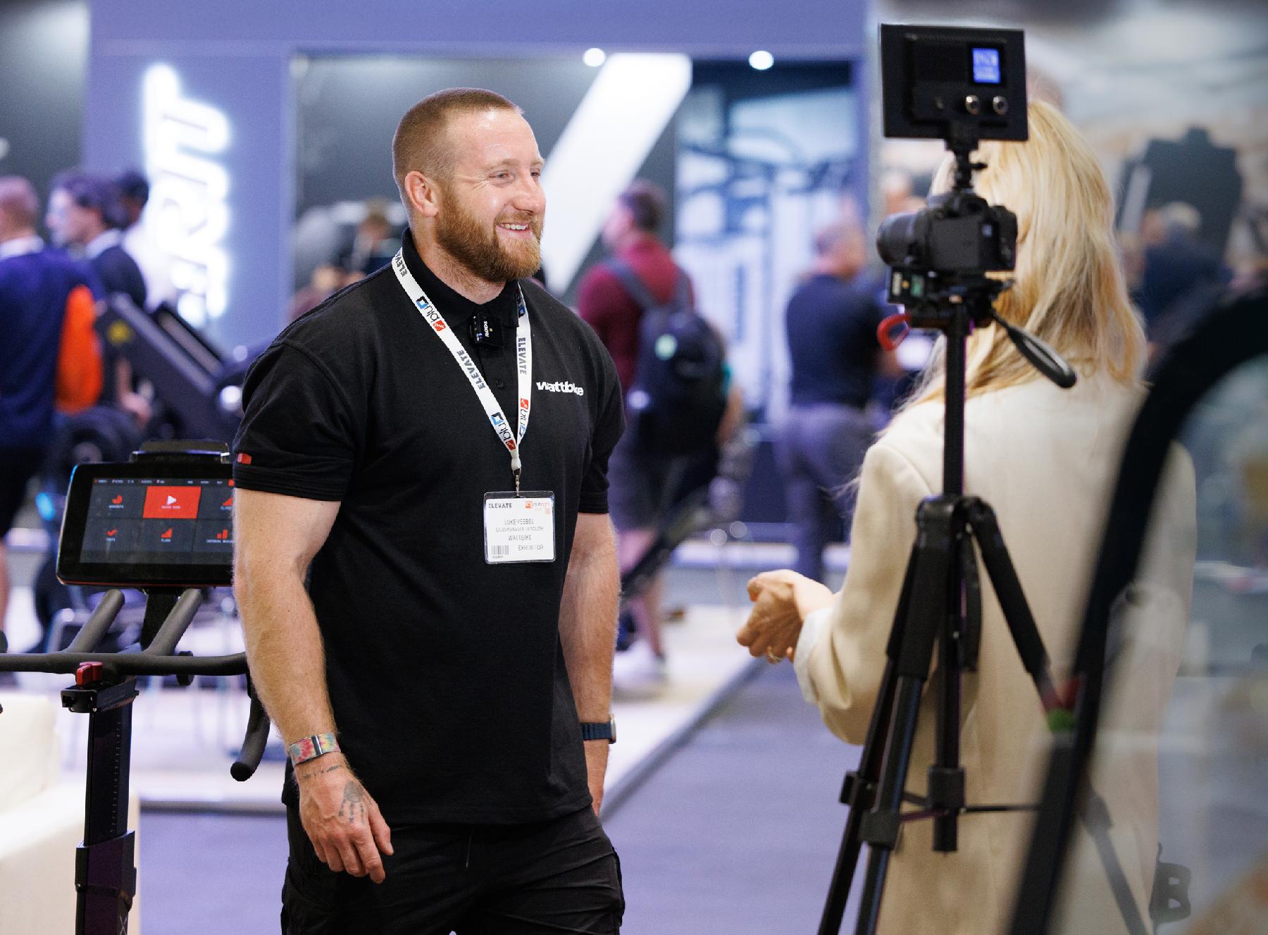 Exhibitor being filmed