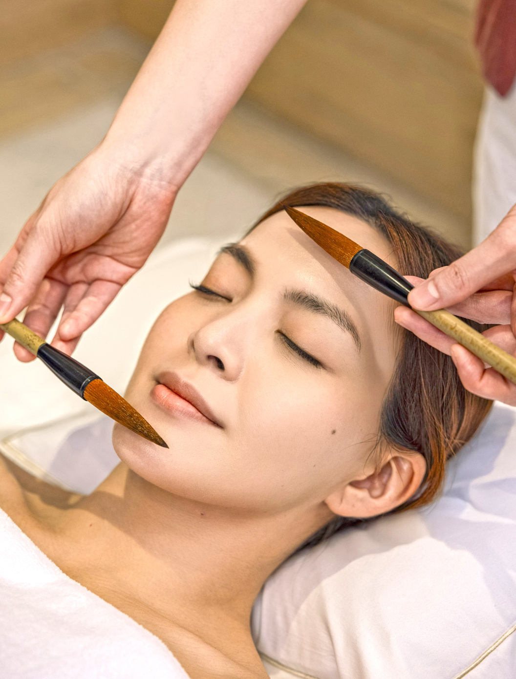 Woman having facial