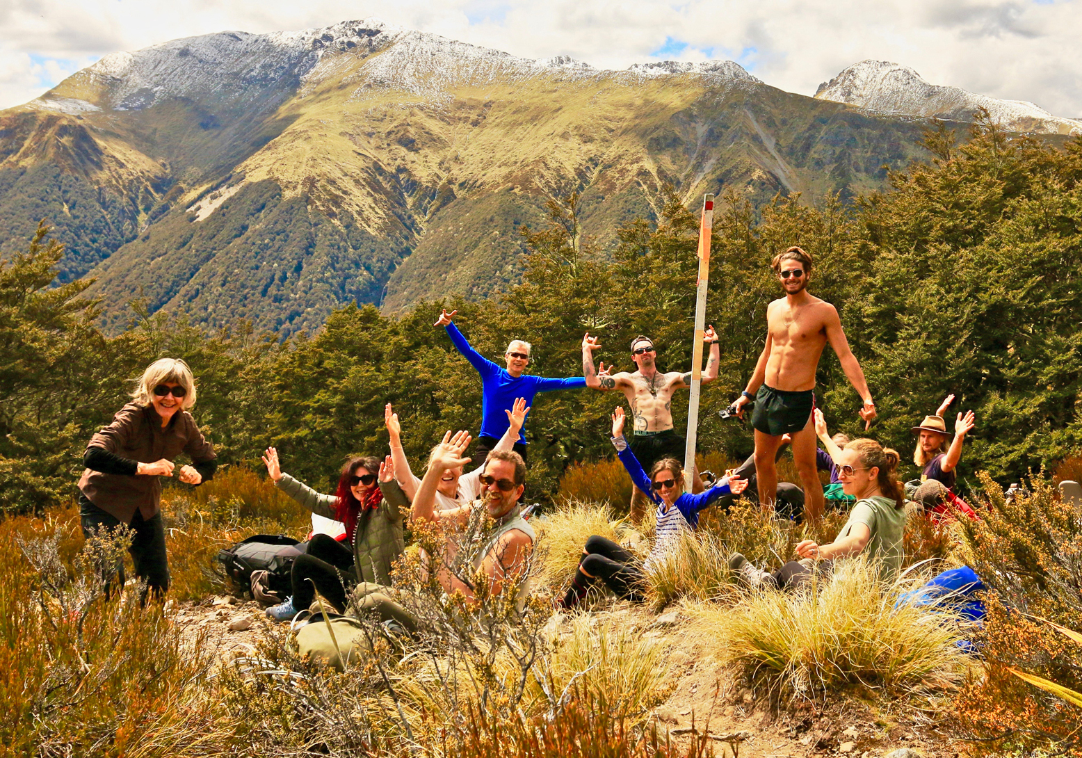 Group posing in mountains