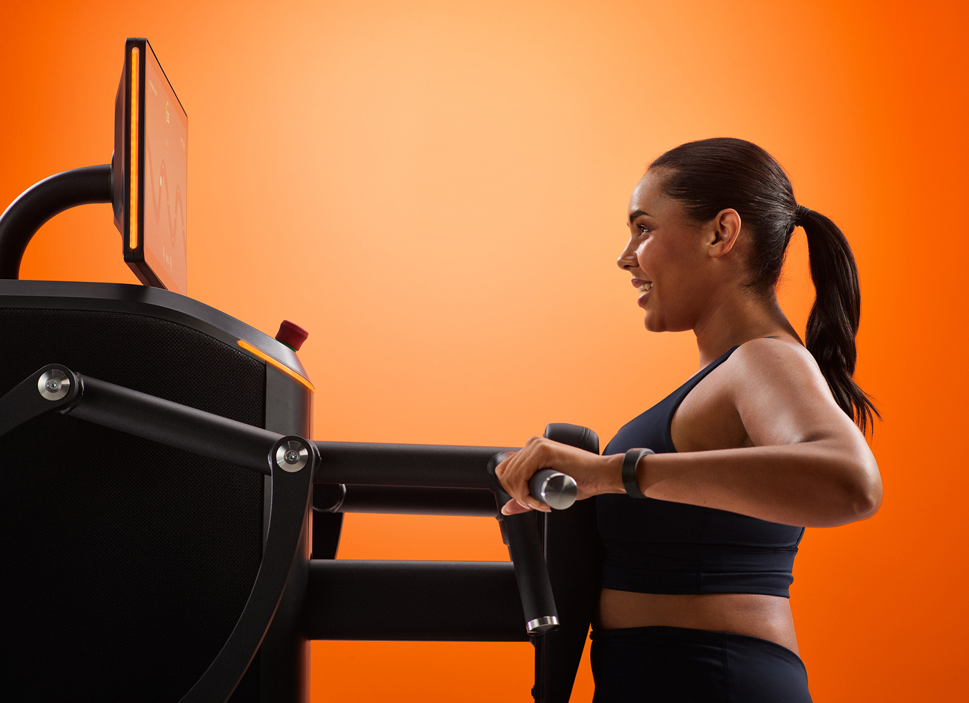 Woman using Egym equipment