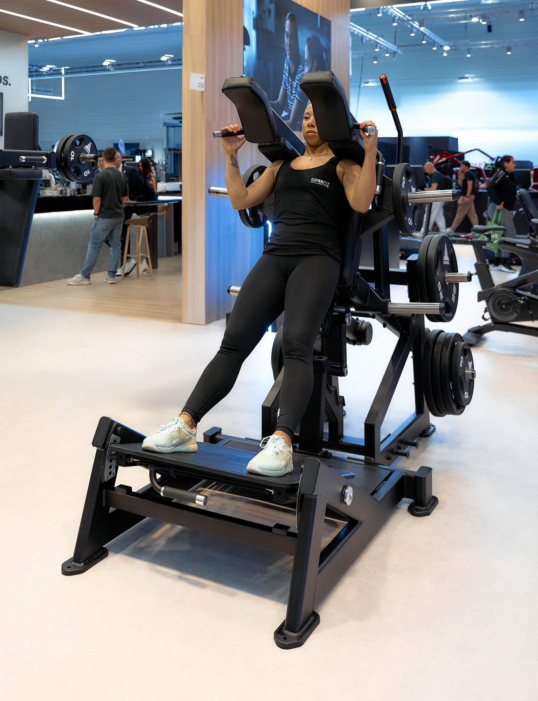 Woman using Nautilus Leverage range equipment