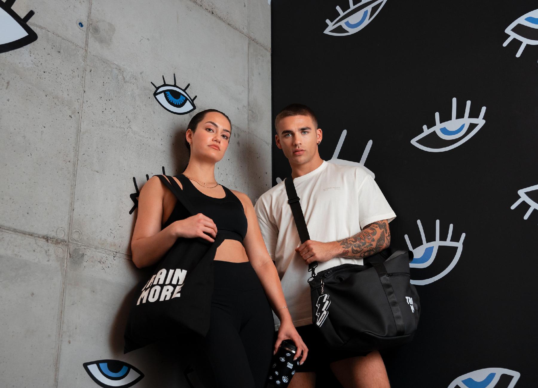Couple with training bags posing