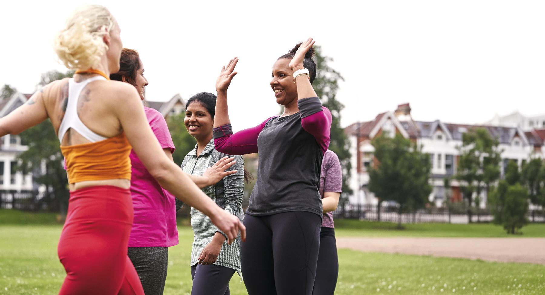 Group of women in gym wear outside