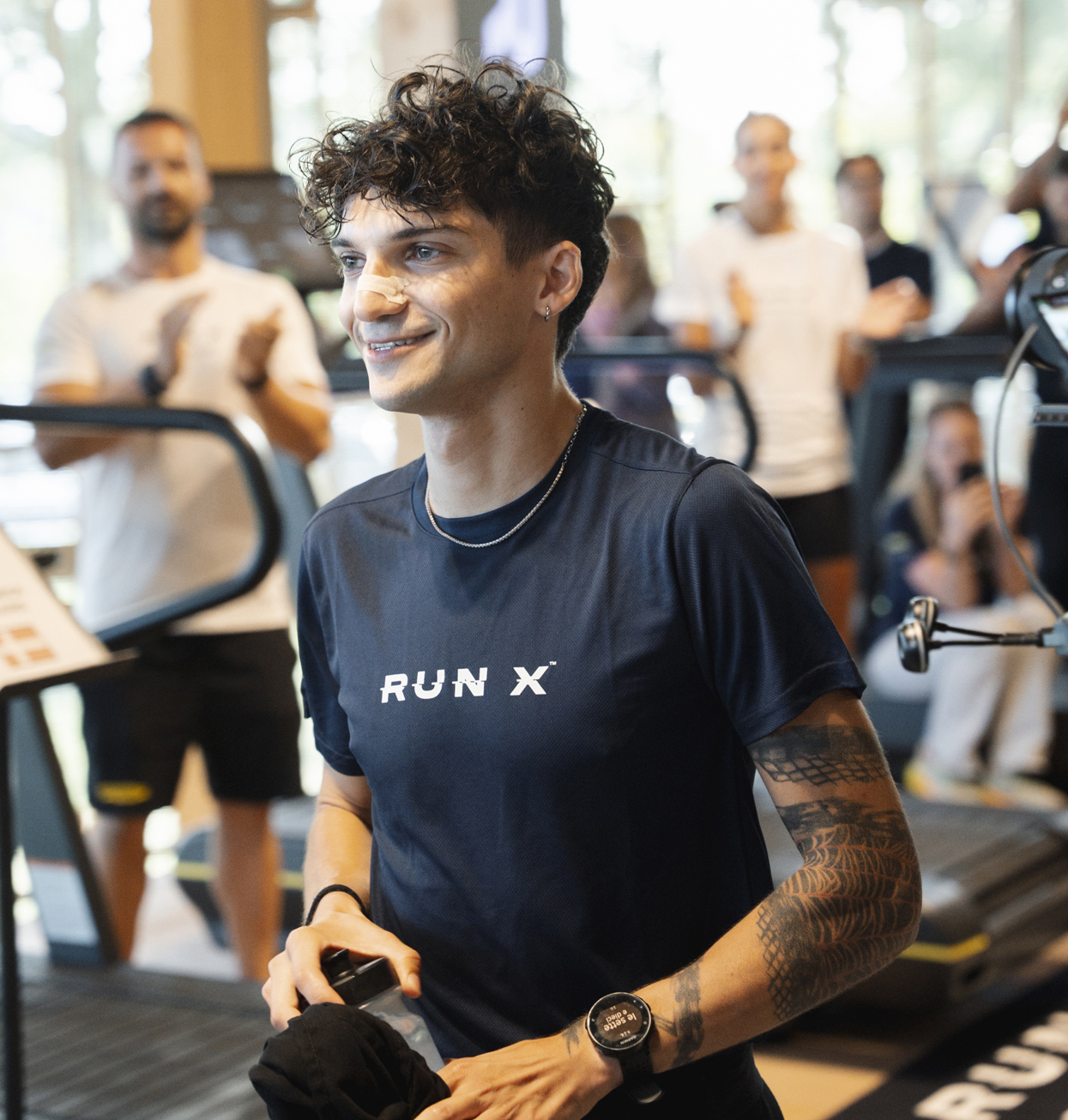 Young man in RUN X t-shirt Young man in RUN X t-shirt