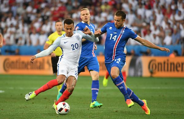 Iceland’s Amason attempts to take the ball from England’s Alli / Jonathan Brady / press association