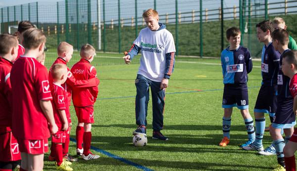 Sunderland footballer Duncan Watmore talks to youngsters as he opens a new 3G pitch in Bishop Auckland