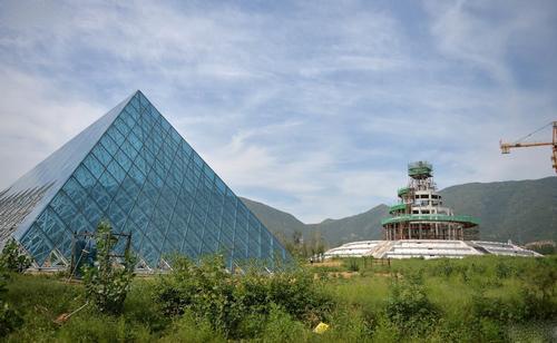 The replica Louvre sits in an overgrown field of the unique amusement park