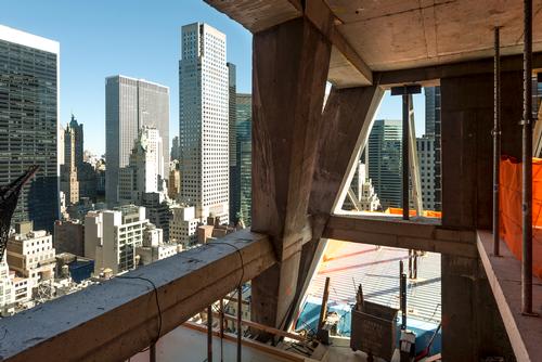 The building has been designed around an angular framework of naked concrete, and an exposed structural system, referred to by Nouvel as the diagrid / Giles Ashford