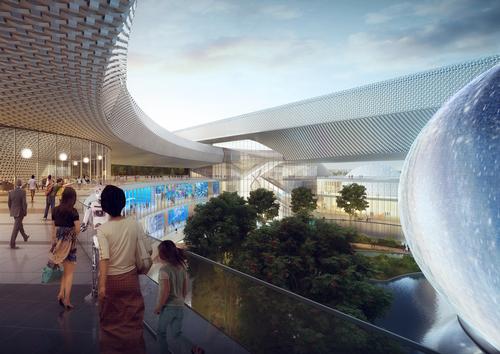 A metal mesh skin transitions from opaque to transparent to control daylight and solar gain