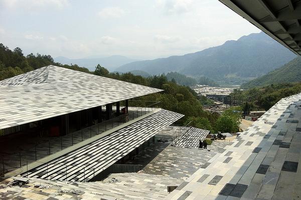 Locally quarried stone was used to evoke the landscape in China’s Yunnan province