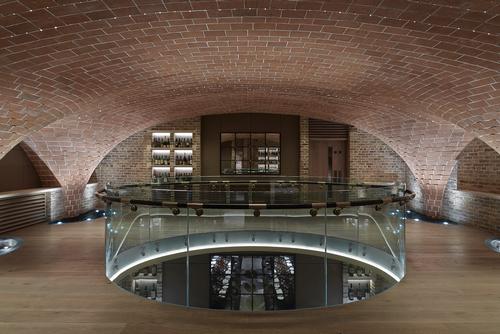 Archways and columns extend through the mezzanine and the sub-basement of the Sussex Cellar
