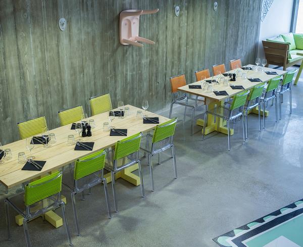 Splashes of colour contrast with the neutral walls and flooring in the restaurant. Philippe Starck furniture has been used throughout the facility, which is spread over five floors