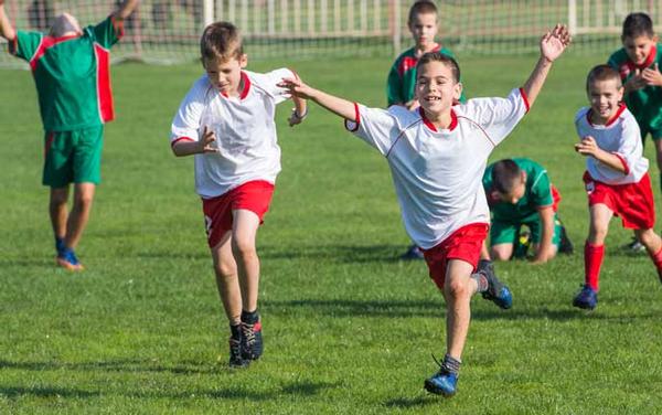 Football is helping kids deal with emotional traumas suffered during their journeys
