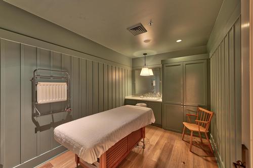 Each treatment room is outfitted with light wood flooring, new massage tables, furnishings and equipment, and coloured with deep green tones
