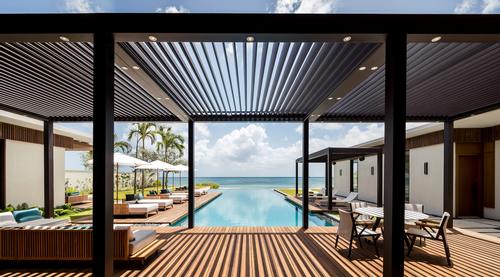 Exterior spaces echo the architecture’s modern lines through gardens, courtyards and water features., and terraces, daybed areas and pools are designed to blend into the architecture