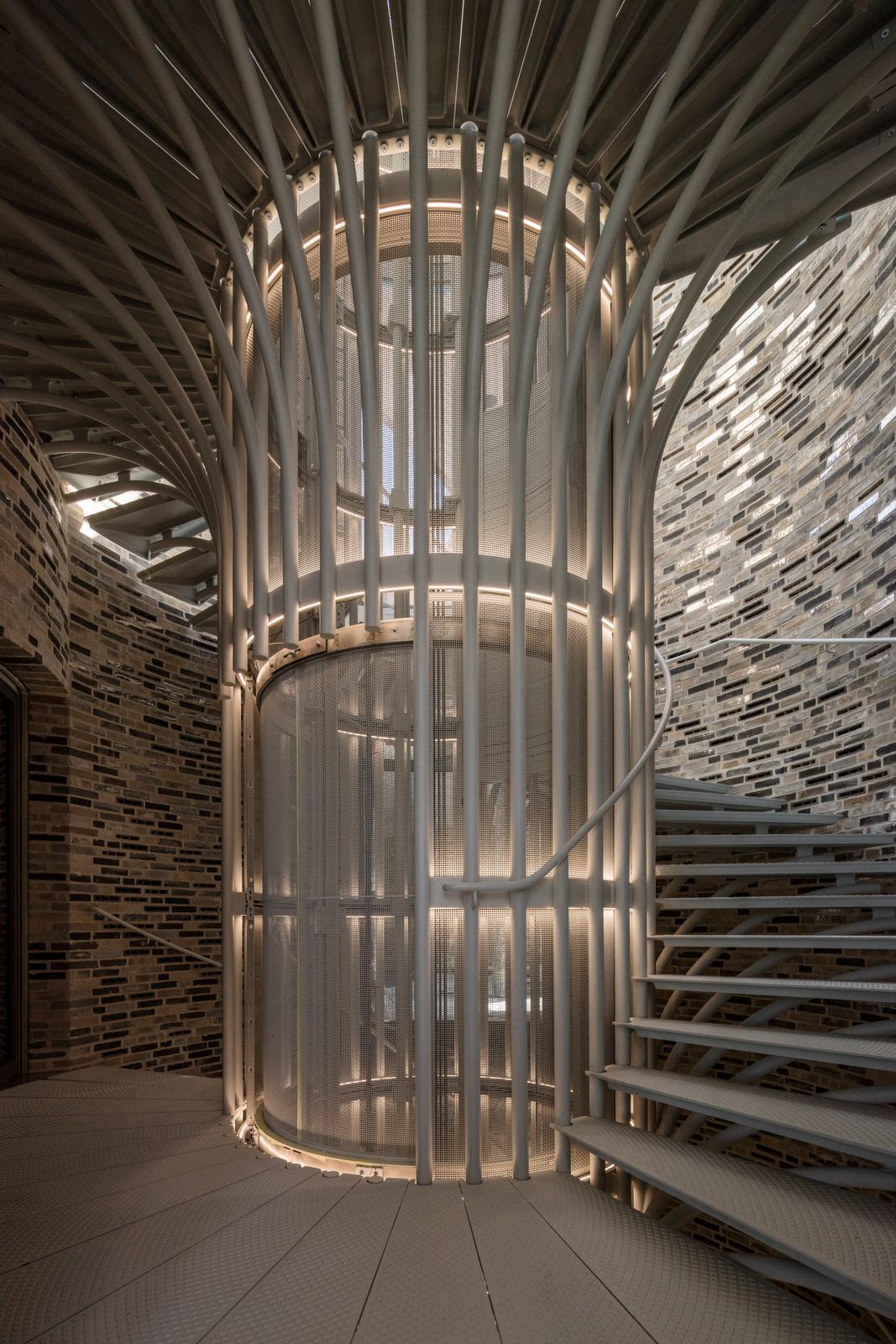 The cavernous structure also features a built-in elevator and spiral staircase. / Photo by Anders Sune Berg