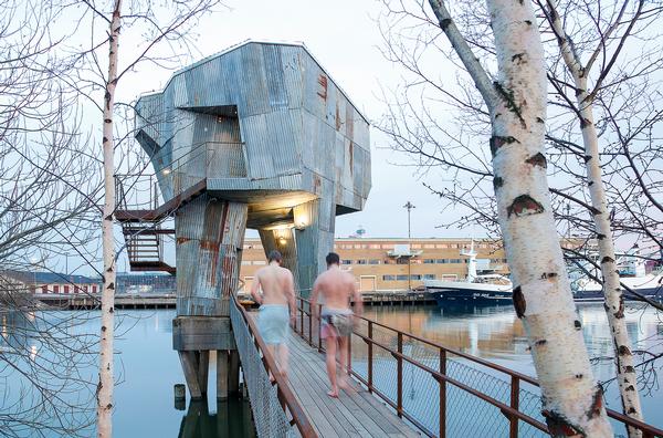Visitors access the sauna via a wooden bridge. It is part of a wider project aiming to revitalise the harbour