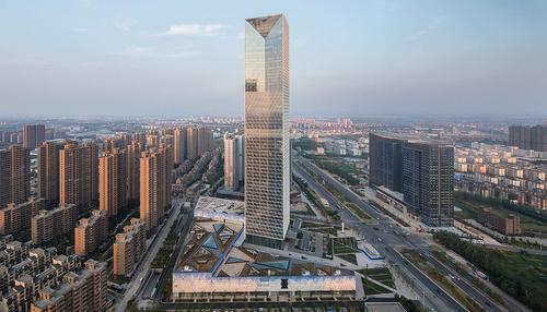 The 268m (879ft), 56-storey tower is located in the Gaoxin District of Nanchang, China / SOM