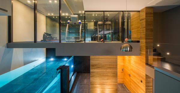 The gym sits on a glass floor over the lap pool, giving great views while working out