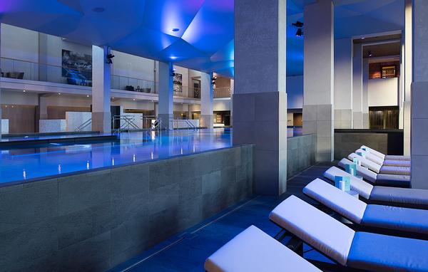 The main pool features a contemporary design with lighting used to change the mood